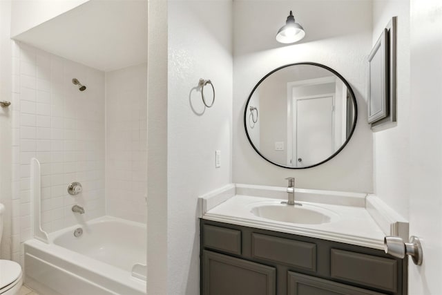 full bathroom with vanity, toilet, and tiled shower / bath combo