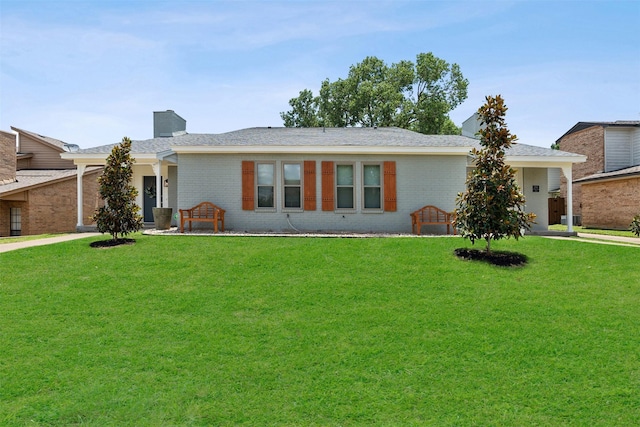 single story home with a front lawn