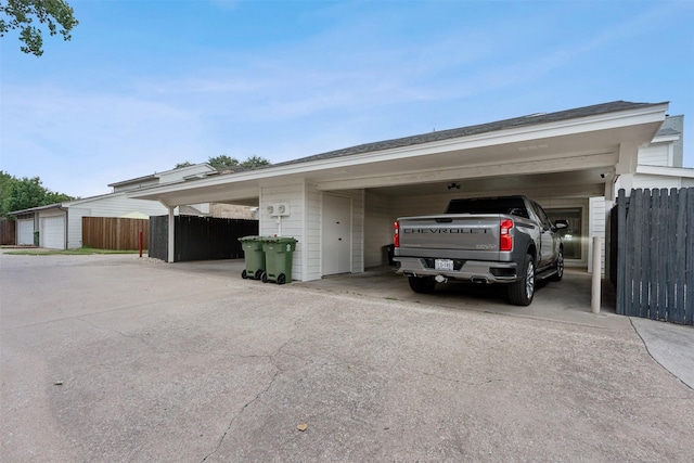 view of car parking featuring a garage