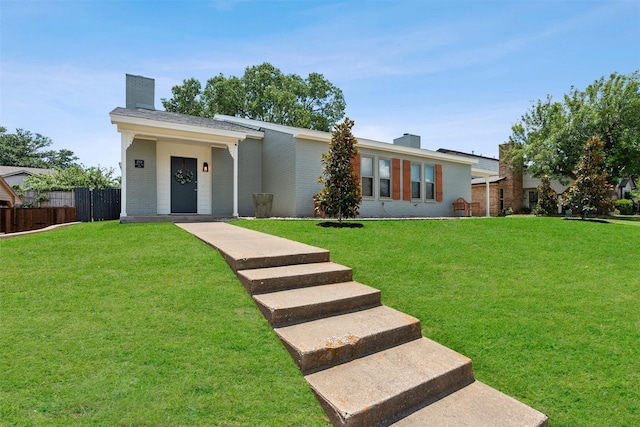 single story home featuring a front lawn