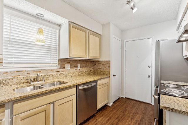 kitchen with decorative backsplash, appliances with stainless steel finishes, a textured ceiling, sink, and pendant lighting