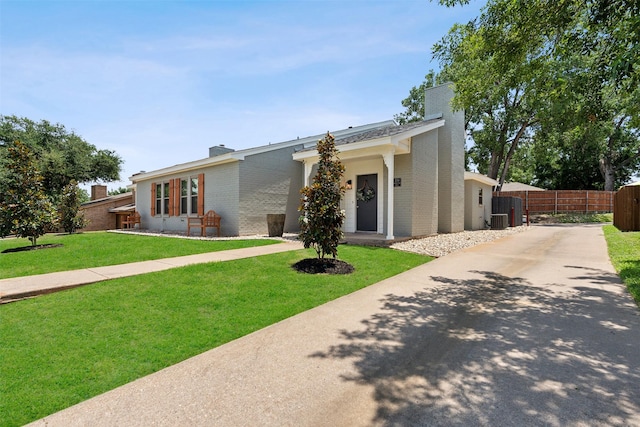 ranch-style house with a front lawn