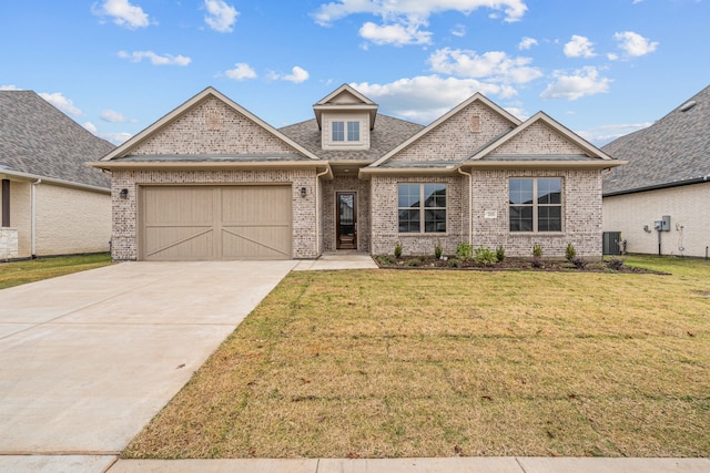 craftsman inspired home with cooling unit, a garage, and a front lawn