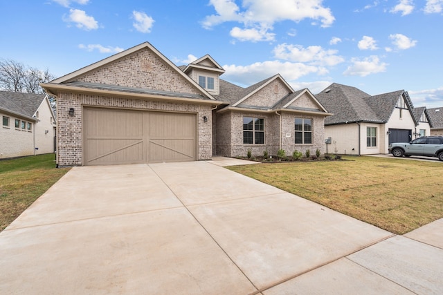 view of front of property with a front yard and a garage