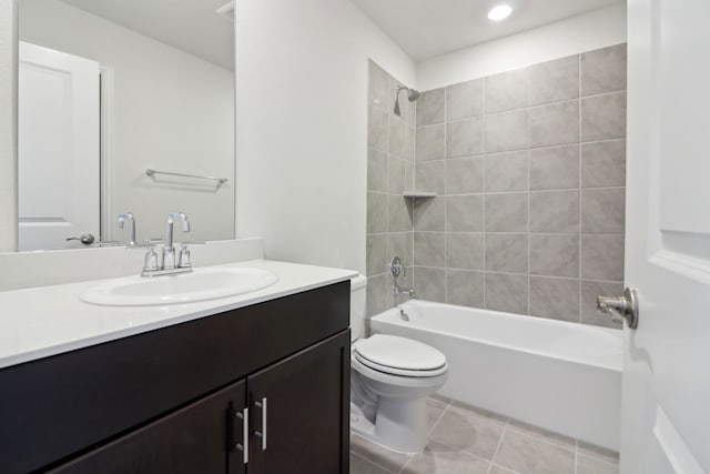 full bathroom with toilet, vanity, tile patterned flooring, and tiled shower / bath combo