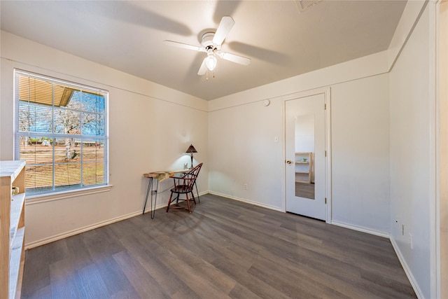 interior space with dark hardwood / wood-style flooring and ceiling fan