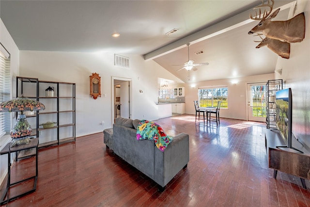 living room featuring lofted ceiling with beams, dark hardwood / wood-style floors, and ceiling fan