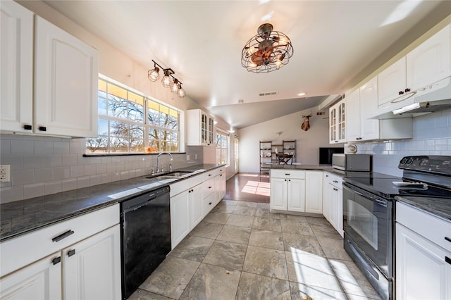 kitchen featuring sink, tasteful backsplash, black appliances, white cabinets, and vaulted ceiling