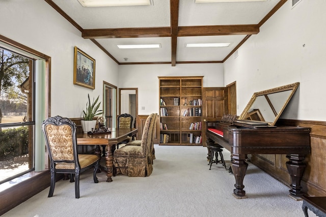 office with ornamental molding, light colored carpet, and beam ceiling