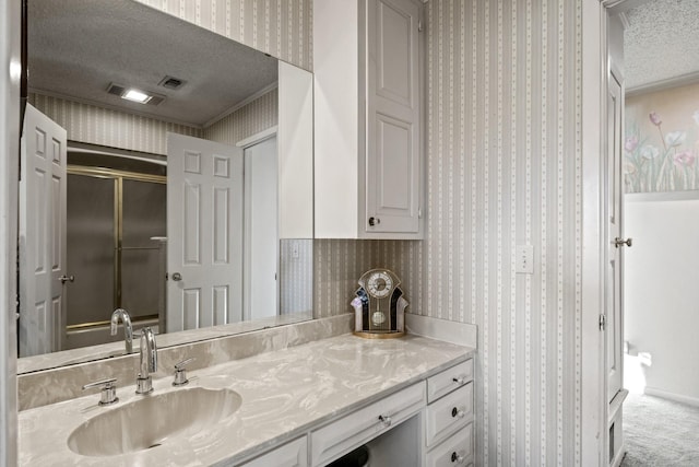 bathroom featuring vanity and a textured ceiling