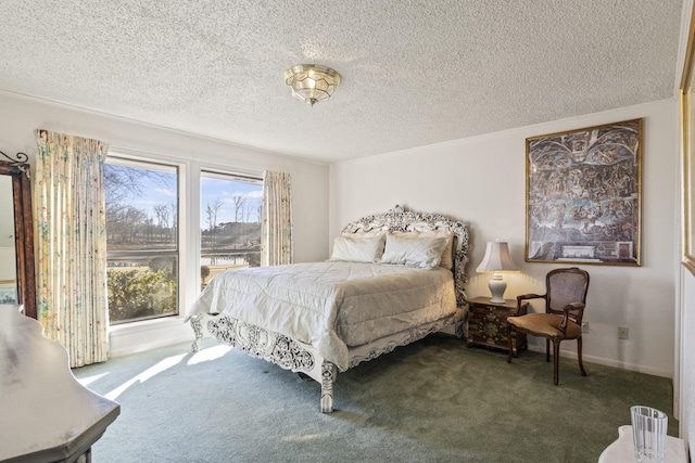 carpeted bedroom with ornamental molding and a textured ceiling