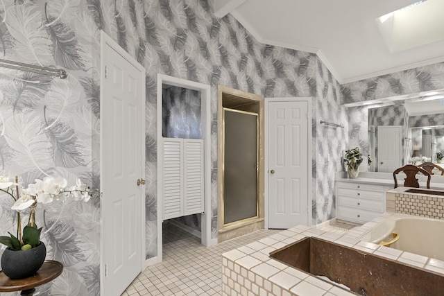 bathroom with tile patterned flooring, vanity, crown molding, and separate shower and tub