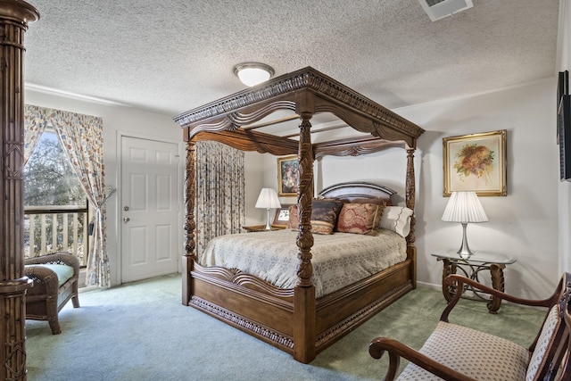 bedroom featuring carpet floors and a textured ceiling