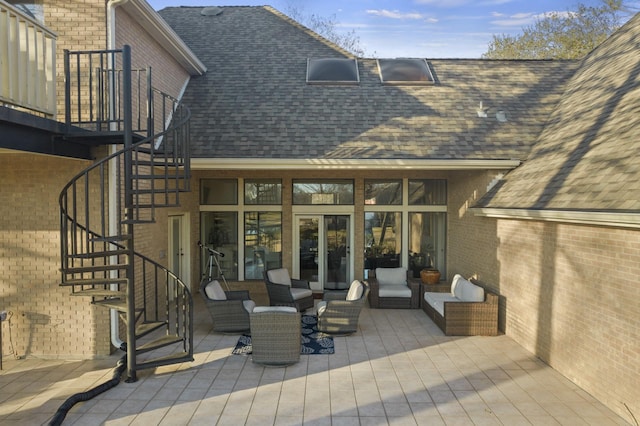 back of property featuring a wooden deck and outdoor lounge area