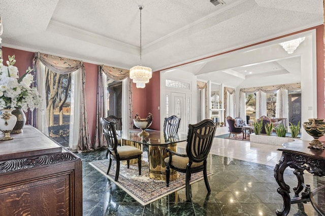 dining room featuring a notable chandelier, crown molding, a raised ceiling, and a textured ceiling