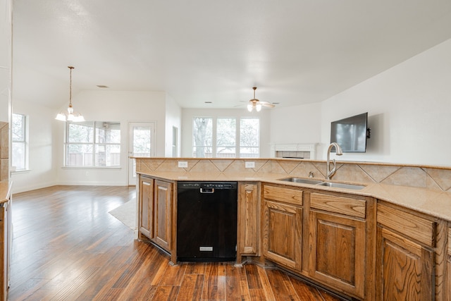 kitchen featuring decorative backsplash, sink, black dishwasher, dark wood-type flooring, and ceiling fan with notable chandelier