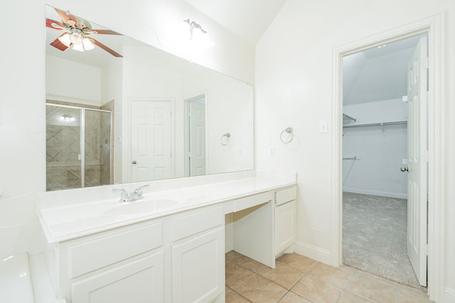 bathroom featuring ceiling fan, vanity, tile patterned flooring, and a shower with door