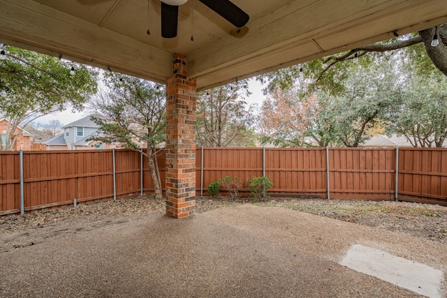 view of patio featuring ceiling fan