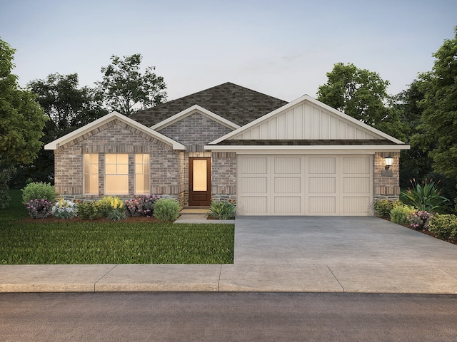 view of front facade with a garage and a front lawn