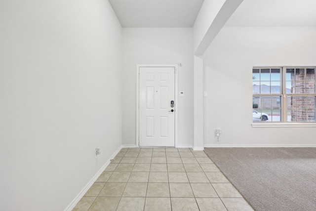 entryway with light tile patterned floors