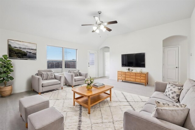 living room with light colored carpet, ceiling fan, and lofted ceiling