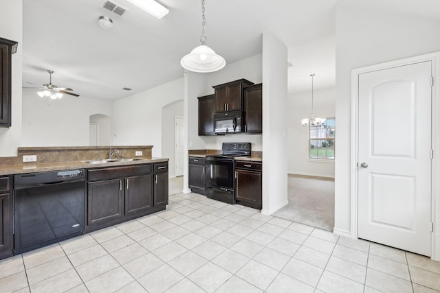 kitchen featuring dark brown cabinets, ceiling fan with notable chandelier, sink, black appliances, and decorative light fixtures