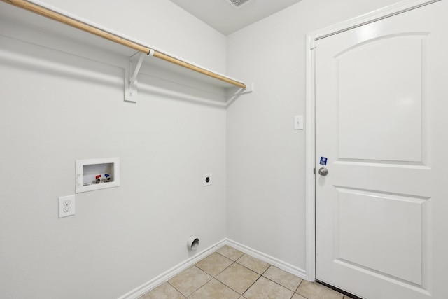 laundry room featuring electric dryer hookup, light tile patterned flooring, and hookup for a washing machine