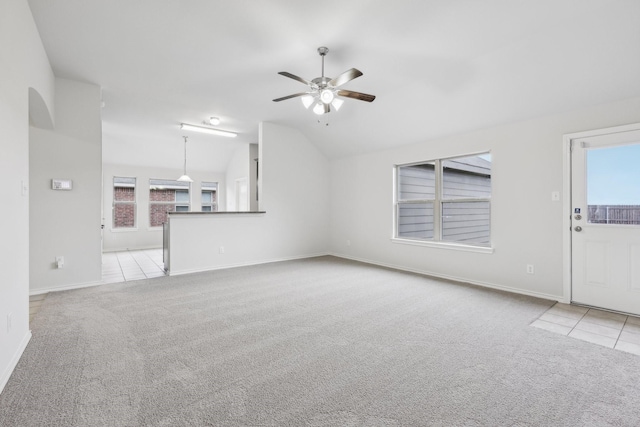 unfurnished living room with light carpet, ceiling fan, and lofted ceiling