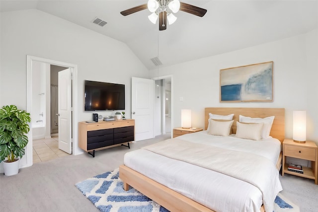 bedroom featuring ensuite bathroom, ceiling fan, and lofted ceiling