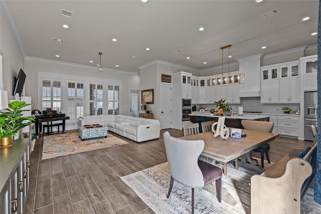 dining room featuring ceiling fan and ornamental molding