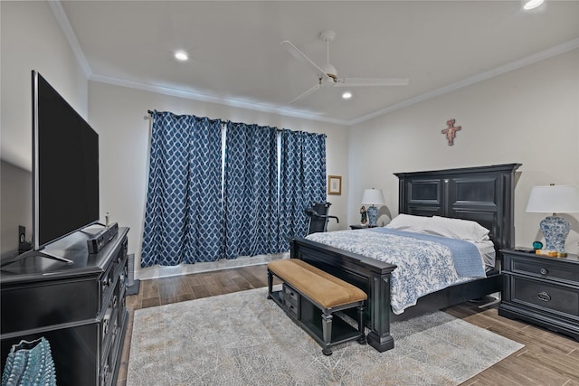 bedroom with ceiling fan, light hardwood / wood-style flooring, and crown molding