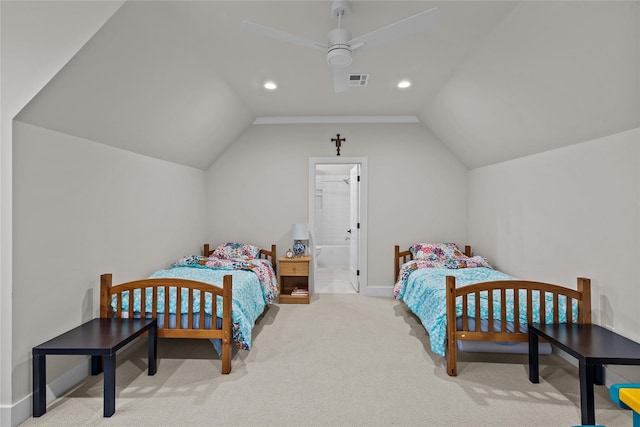 carpeted bedroom with connected bathroom, vaulted ceiling, and ceiling fan