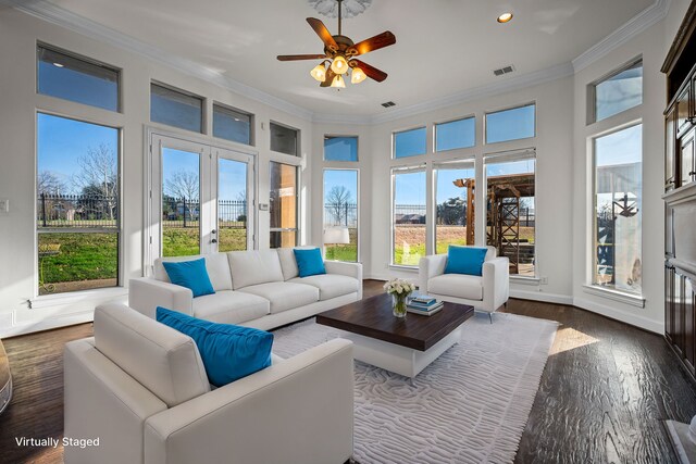 sunroom with visible vents and a healthy amount of sunlight