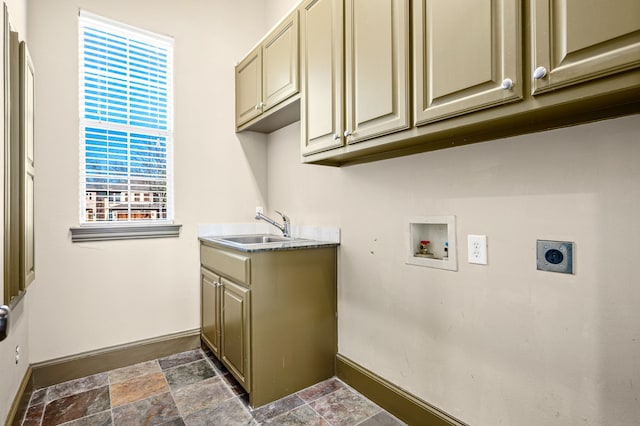 laundry area featuring baseboards, washer hookup, cabinet space, electric dryer hookup, and a sink