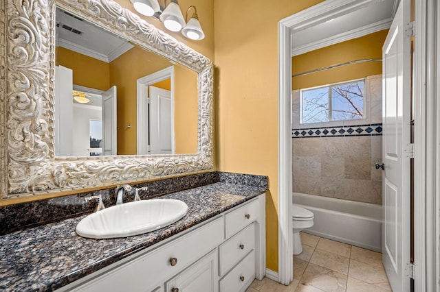 full bathroom with ornamental molding, toilet, tiled shower / bath combo, and vanity