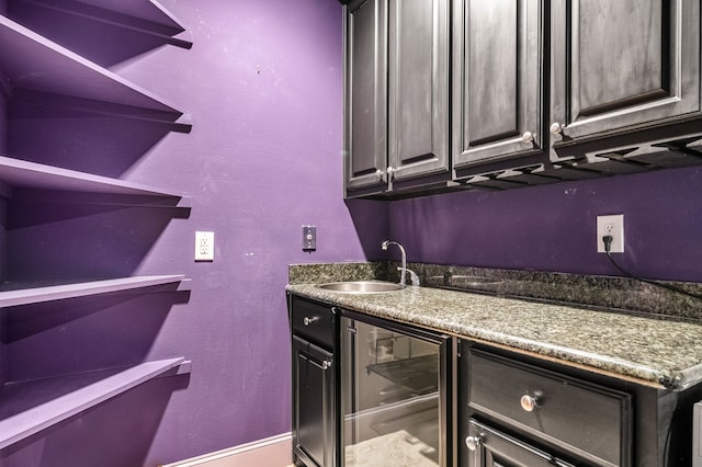 bar with wet bar, wine cooler, and a sink