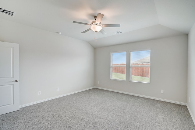 empty room with carpet flooring, ceiling fan, and lofted ceiling