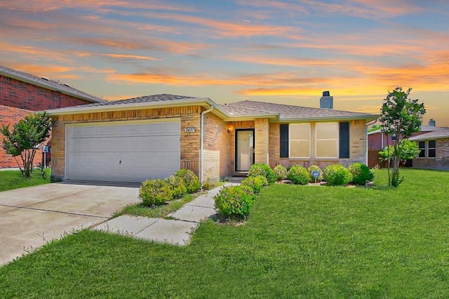 ranch-style house with a yard and a garage