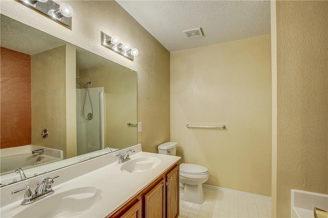 full bathroom with vanity, toilet, a textured ceiling, and independent shower and bath