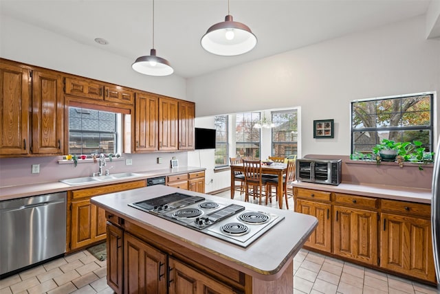 kitchen with stainless steel refrigerator with ice dispenser, pendant lighting, black electric stovetop, light tile patterned floors, and a chandelier