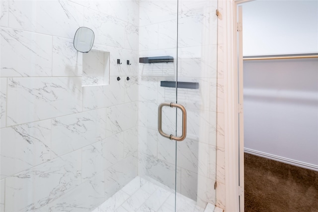 bathroom featuring an enclosed shower