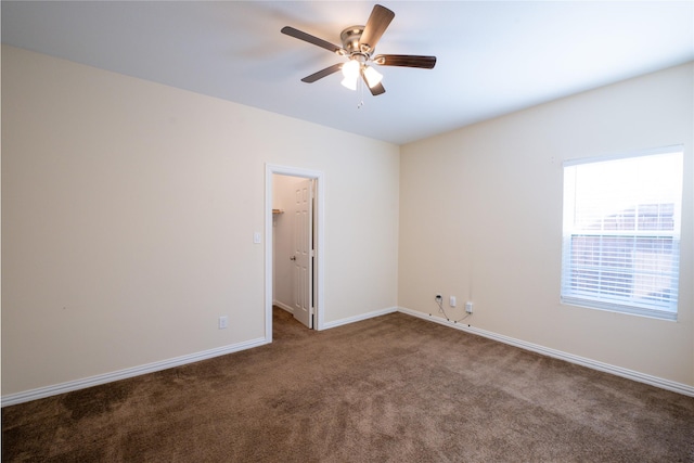 carpeted empty room featuring ceiling fan