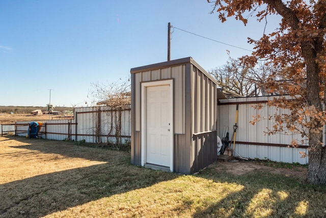 view of outbuilding with a lawn