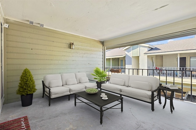 view of patio / terrace with an outdoor living space and a balcony