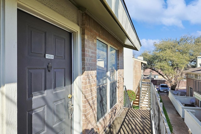 property entrance with a balcony