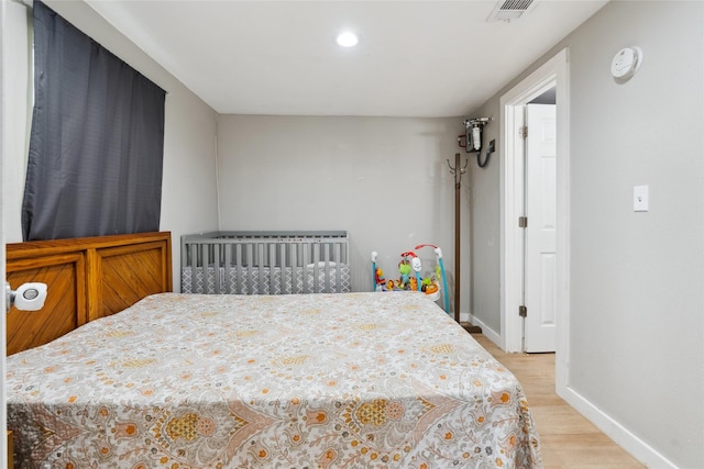 bedroom with light hardwood / wood-style flooring