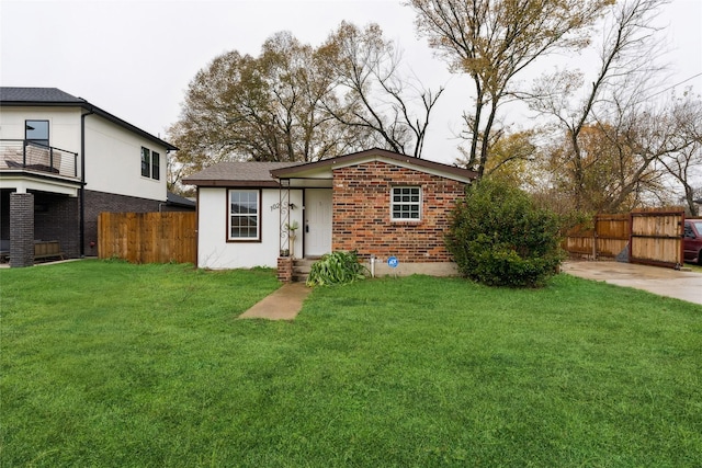 rear view of property with a yard