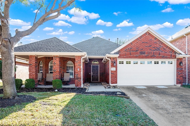 view of front of house with a porch, a garage, and a front yard