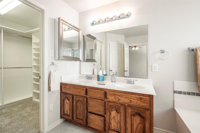 bathroom featuring vanity and ceiling fan