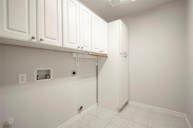 laundry room featuring electric dryer hookup, cabinets, and hookup for a washing machine